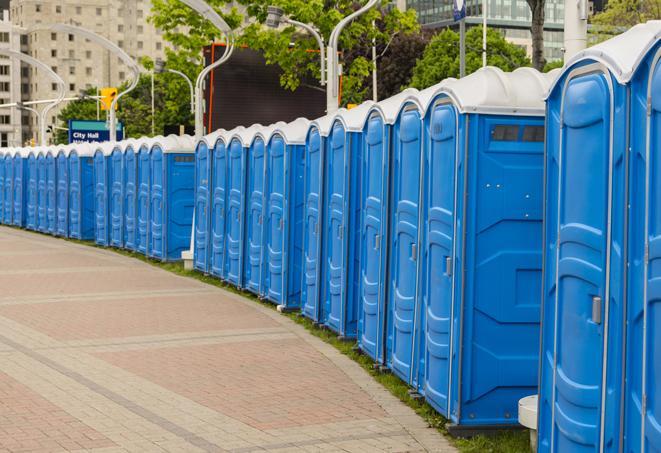 hygienic portable restrooms lined up at a music festival, providing comfort and convenience for attendees in Grant-Valkaria FL